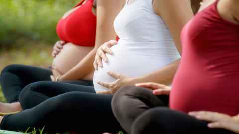 Pregnant mothers sitting cross-legged